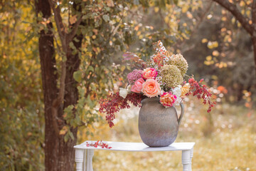 beautiful bouquet on wooden shelf in garden