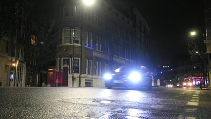 Cars Driving London Streets at Night