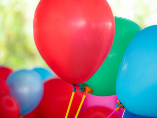 colorful balloons with happy celebration party background. bunch of colorful balloons on background. close-up image of the bright colored balloons.