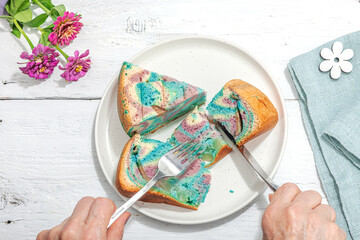 Apple pie in unicorn colors ready to eat. Homemade baking, nostalgic food. Hard light, dark shadow