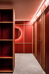 room with red wall and shelves