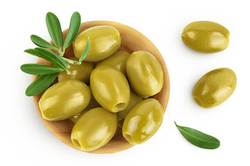 Green olives with leaves in wooden bowl isolated on a white background with full depth of field....