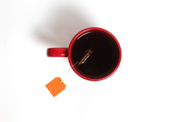 The Red Cup with Label Tea on a White Background Top View