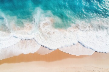 Aerial view of a beautiful sandy beach with turquoise ocean waves