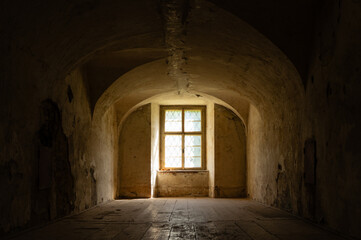 Abandoned baroque style room with window and wooden floor