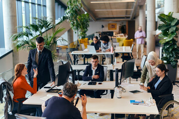 In a modern startup office, a diverse group of young professionals collaboratively tackles various...