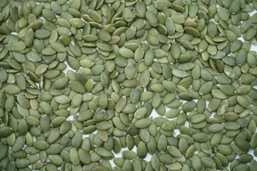 Macro background texture of green pumpkin seeds