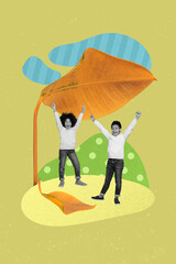 Vertical collage image of two excited mini people raise fists stand under big fallen leaf parasol protect rain water isolated on green background