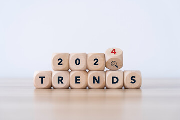 2024 forecast and trend concept. on flip wooden cube in gray background on desk. start of the new year 2024 by new trends business and fashion for plan to goals, marketing strategy concept - obrazy, fototapety, plakaty