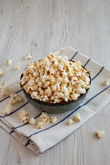 Homemade Buttered Popcorn with Salt in a Bowl, side view.
