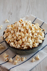 Homemade Buttered Popcorn with Salt in a Bowl, side view.