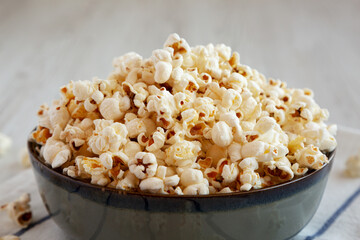 Homemade Buttered Popcorn with Salt in a Bowl, side view. Close-up.