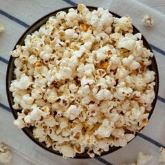 Homemade Buttered Popcorn with Salt in a Bowl, top view. Flat lay, overhead, from above.