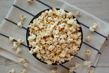 Homemade Buttered Popcorn with Salt in a Bowl, top view. Flat lay, overhead, from above.