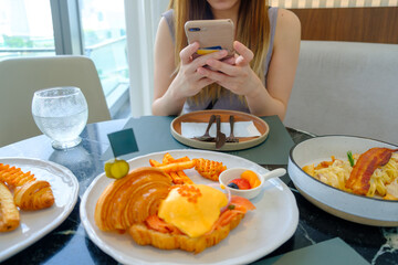 Foodie's Delight: Woman Capturing Table Full of Italian Dishes for Coffee Date Idea