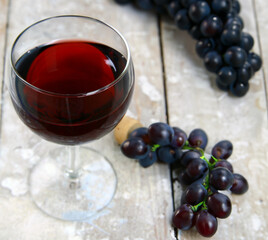 glass of red wine on a wooden table