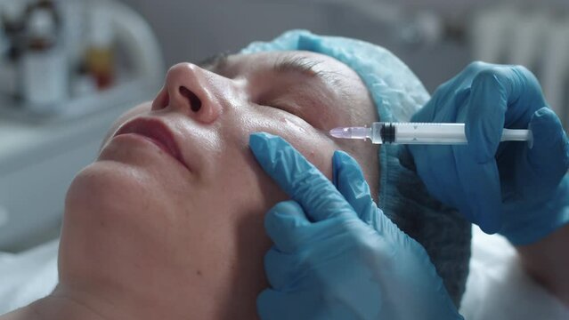 Beauty injections in cheekbones for an adult woman