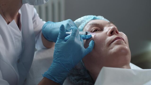 Beauty injections under eyes for an adult woman
