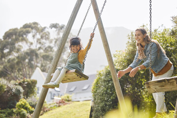Happy, swing and mother and girl in park for playing, bonding and having fun together outdoors....