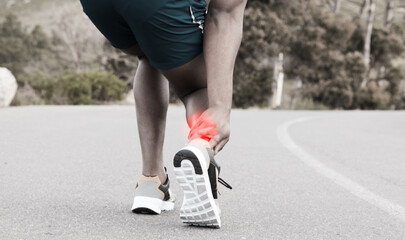Fitness, injury or runner with ankle pain on road to exercise legs in training or outdoor cardio workout. Red glow, emergency or injured sports athlete suffering from broken foot after running a race