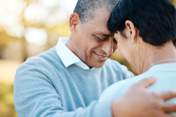 Happy, connection and senior couple hugging in a park on an outdoor date for romance, bonding or...