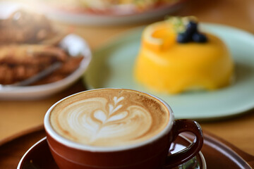 high angle view of coffee cup on wood grain table Drinking Concept: Hot Coffee, Latte, Espresso, Cappuccino
