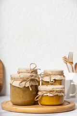 Glass jars with honey in the interior of the kitchen