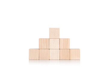 Obraz premium wooden cubes in the form of a pyramid on an isolate white background