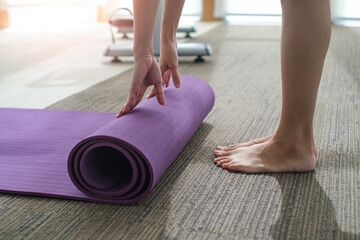 beautiful young healthy caucasian woman stretching and exercise yoga in gym. Fitness lifestyle indoor. Relaxation workout in sport club background. healthy and care concept.