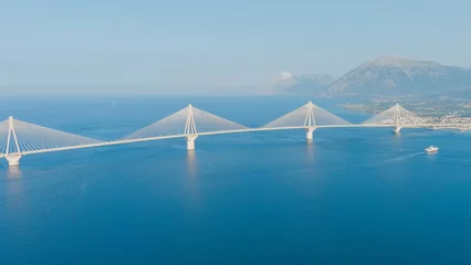 Poster Patras, Greece. The Rio-Antirrio Bridge. Officially the Charilaos Trikoupis Bridge. Bridge over the Gulf of Corinth (Strait of Rion and Andirion), Aerial View © nikitamaykov