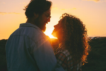 Couple in love enjoy relationship in outdoor leisure activity enjoying a beautiful sunset together...