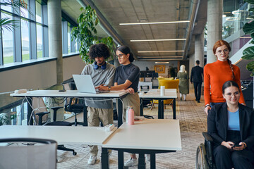Fototapeta premium In a modern startup office, a diverse group of young professionals collaboratively tackles various business problems and challenges, surrounded by their engaged colleagues, fostering innovation and
