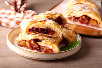 Plum and almond puff pastry strudel
