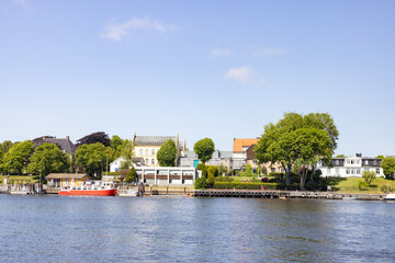 Happy walking in  Fredrikstad city on a great warm summer day, with many old buildings, Norway	