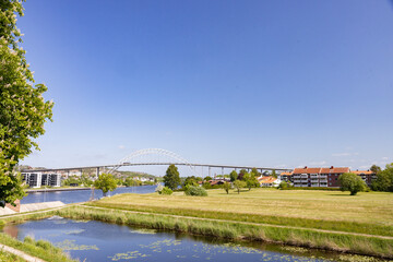Bridge over the river Glomma- Happy walking in  Fredrikstad city on a great warm summer day, with many old buildings, Norway	