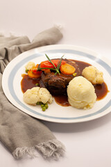roasted lamb meat with vegetables and mash potato