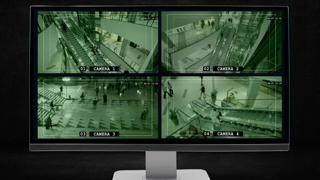 Security service controls the area of the shopping center using a computer with screens on which the image from video surveillance CCTV. Display with interface of the multicamera surveillance system. 