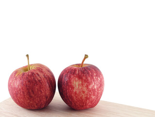 two red apples with water droplets on corner of kitchen desk isolated on transparent