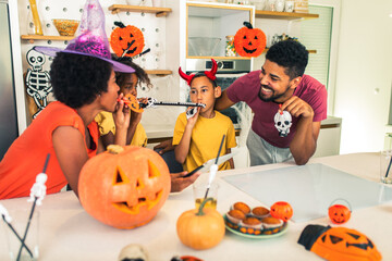 Family has fun in Halloween time make video call with digital tablet.