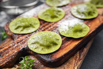 green ravioli fresh green dough  spinach, basil vegetable food meal food snack on the table copy space