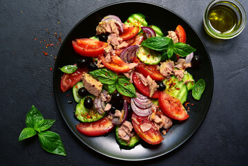 Tuna salad with cucumber and tomato. Top view with copy space.