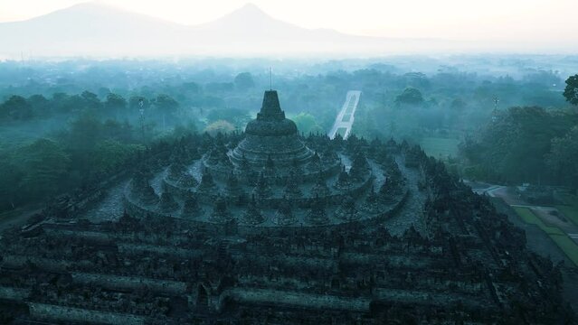 Borobudur temple on the background of sunrise and fog. Aerial view. Java, Indonesia