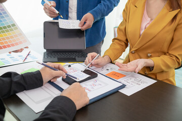 team of UI UX web designer are working together to develop mobile responsive websites with UI UX...