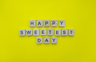 October 21, happy Sweetest Day, minimalistic banner with the inscription in wooden letters