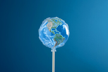 Earth lollipop, candy world. Climate change and ecology, world heritage, summer and travel concept, minimal idea for the global warming. Save the planet poster