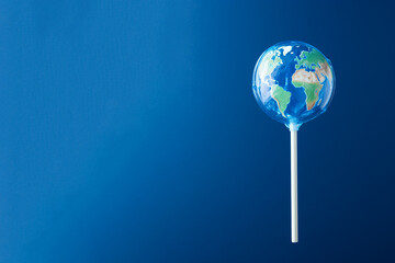 Earth lollipop, candy world. Climate change and ecology, world heritage, summer and travel concept, minimal idea for the global warming. Save the planet poster, copy space for text