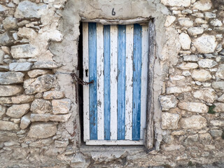 old wooden door of stone village house or home