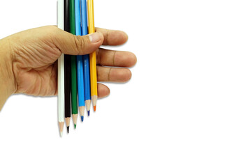 A mix colored pencils in hand isolated on white background with clipping path, back to school concept.