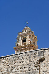 Fototapeta na wymiar Bell tower of the Church of the Monastery of the Holy Cross