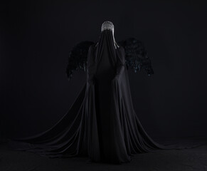 demon angel with black wings on a black background